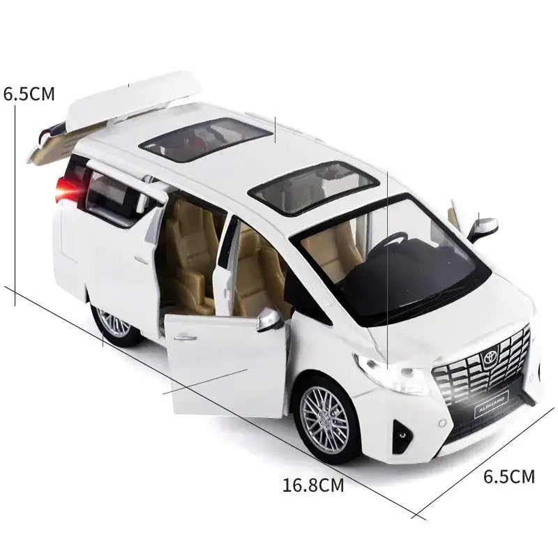 White toyota alphard die-cast model minivan with tan interior and detailed chrome wheels.