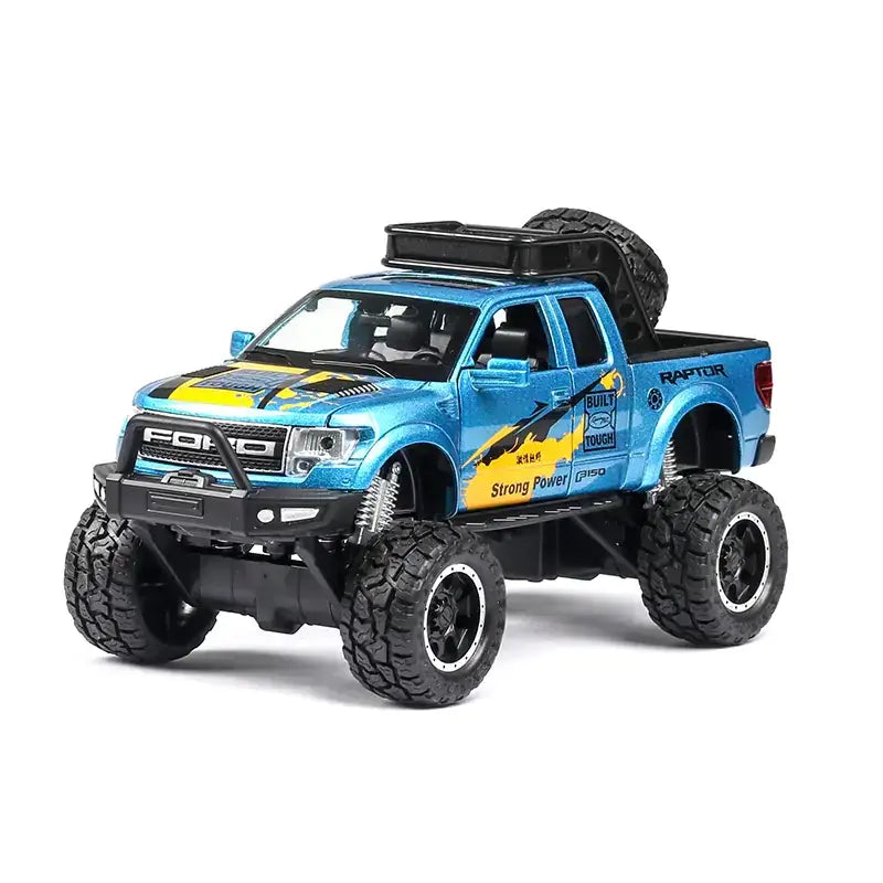 Blue and yellow diecast ford raptor pickup truck model with black tires, roof rack, and detailed decals.