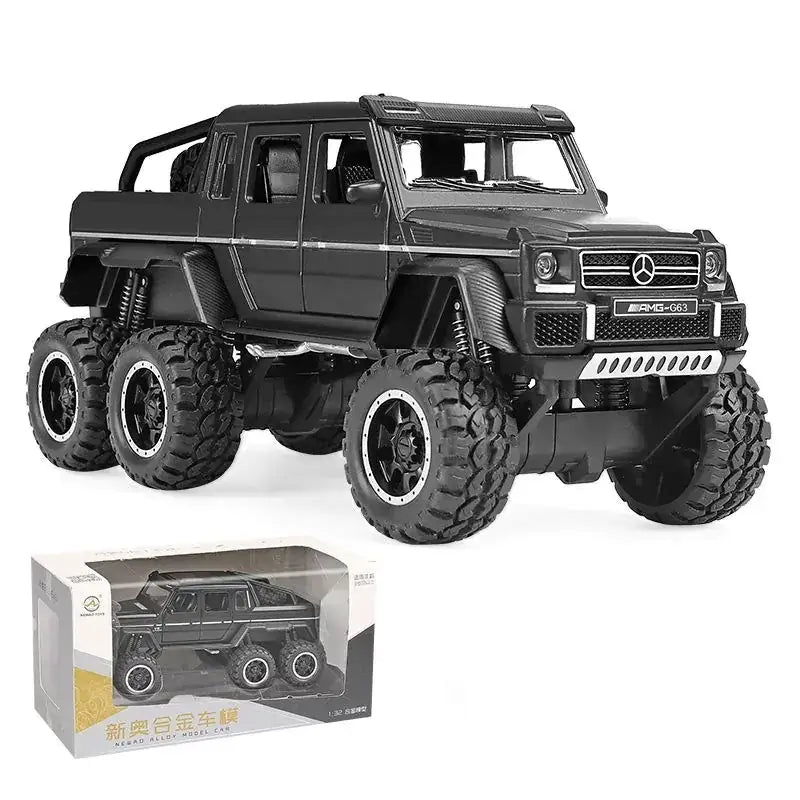 Black mercedes-benz amg g63 alloy model truck with oversized rugged tires and detailed chrome accents.
