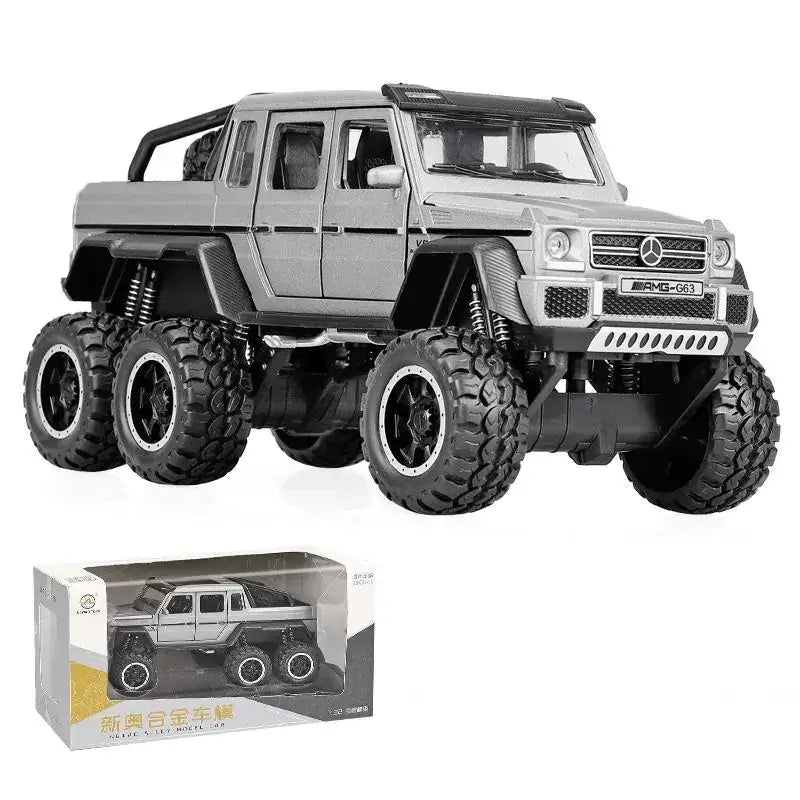 Silver metallic mercedes-benz amg g63 six-wheel drive toy truck with black tires and detailed suspension.