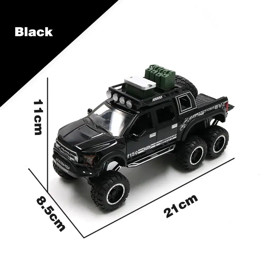 Black die-cast metal toy truck with detailed off-road features and a green spare tire mounted on the roof.