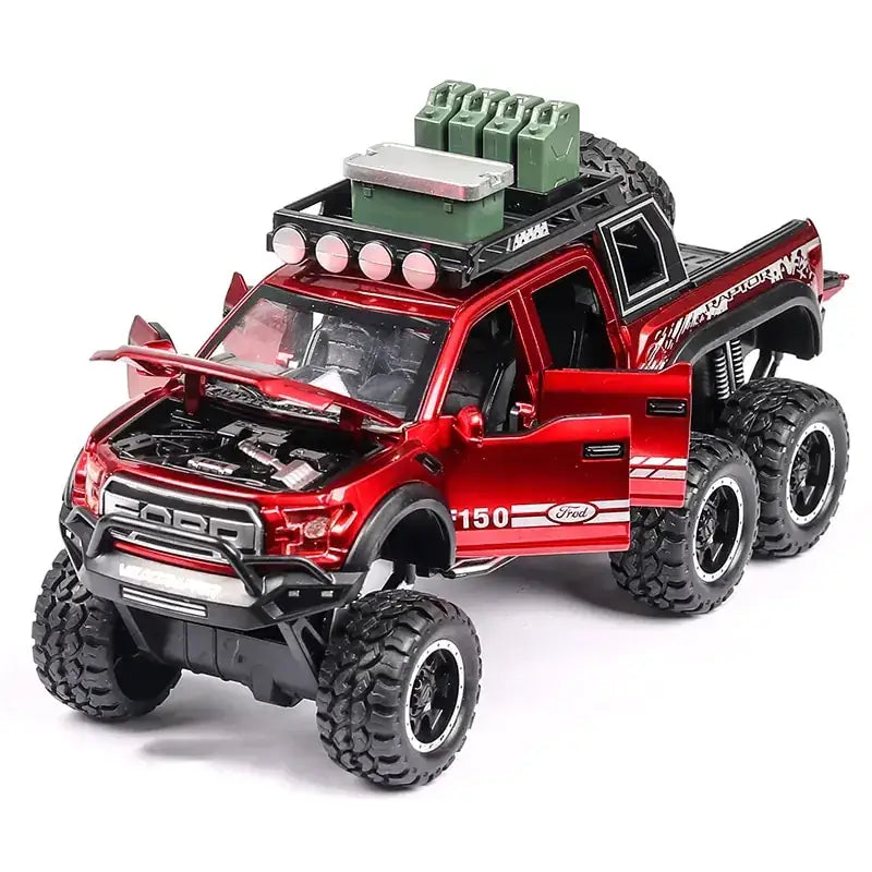 Red metallic ford raptor pickup truck model with black accents, oversized tires, and roof-mounted green fuel cans.
