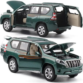 Green die-cast toyota land cruiser prado model suv with detailed interior and engine compartment, featuring beige seats and chrome accents.