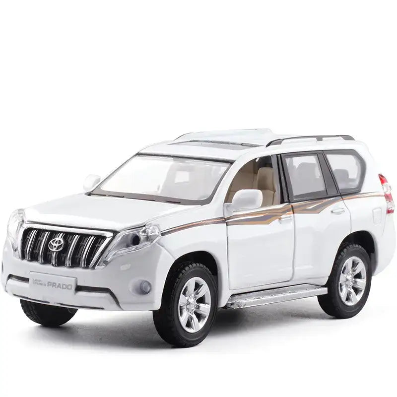 White die-cast toyota prado suv model with silver accents and tan interior trim.