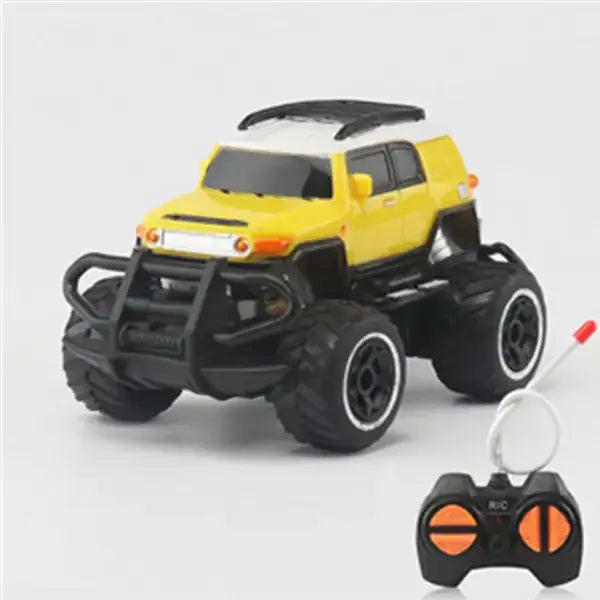 Yellow and black remote-controlled monster truck with oversized tires and a rugged front bumper.