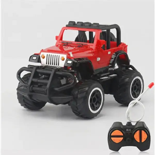 Red remote-controlled jeep monster truck with black tires and a rugged front bumper.