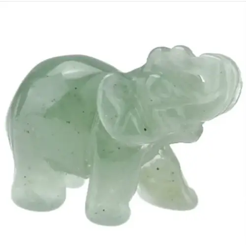 A translucent light green jade elephant figurine with subtle speckles and smooth, polished surfaces.
