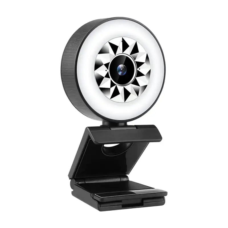 Black webcam with a circular ring light featuring a geometric starburst pattern around the lens.