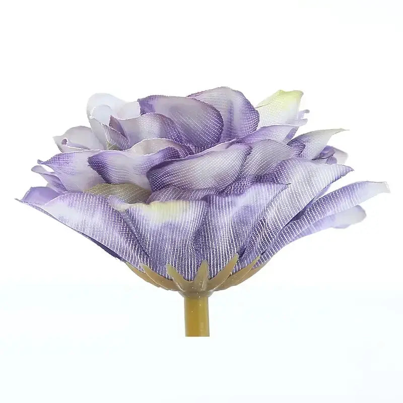 A delicate lavender silk rose with subtle white and yellow gradients on its petals, attached to a slender green stem.