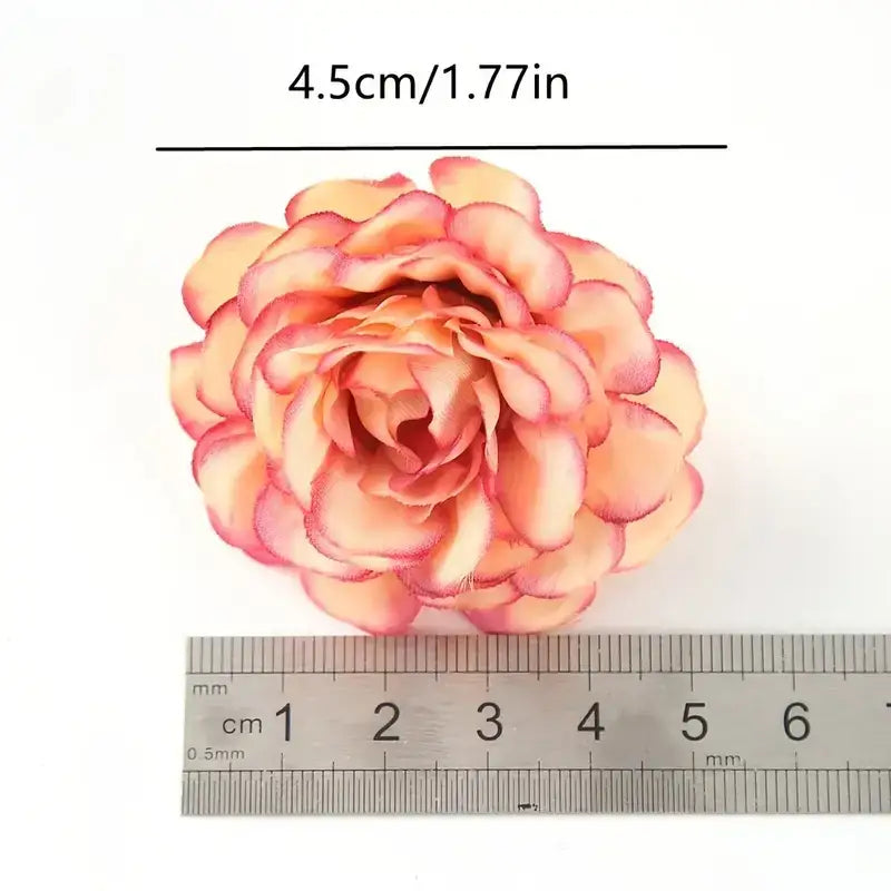 A delicate peach and pink artificial rose with layered petals, measuring 4.5cm in diameter.