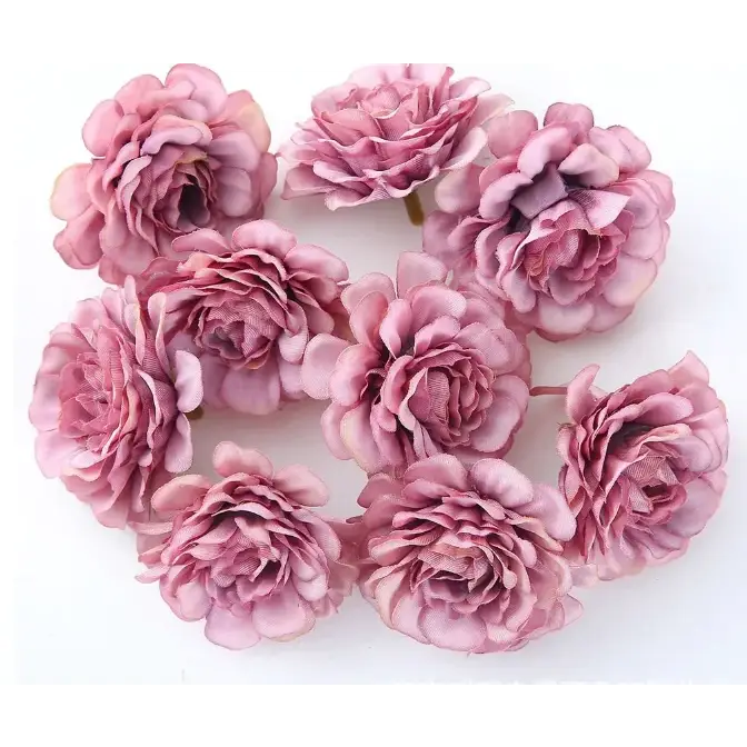 Pink fabric roses with layered petals and subtle shading.