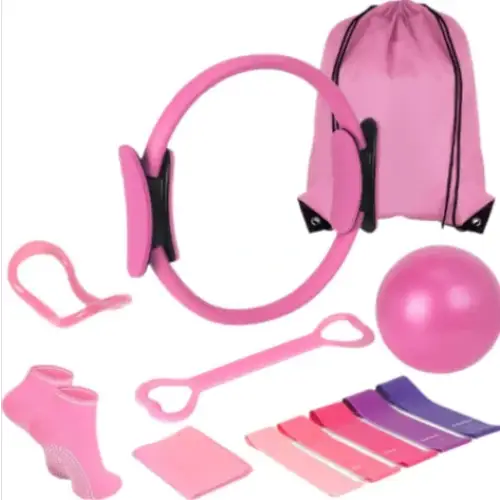 Pink pilates ring with black clips and matching pink drawstring bag
