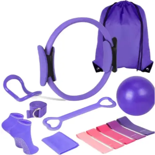 Purple pilates ring with black handles and a matching purple drawstring bag.