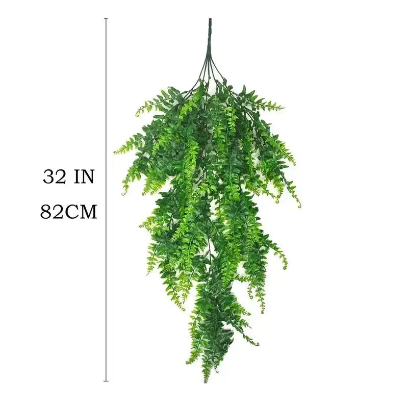 Green artificial fern hanging plant, 32 inches long.