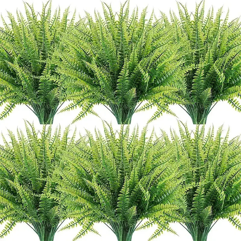 Green artificial fern bouquets with detailed, layered fronds and sturdy stems.