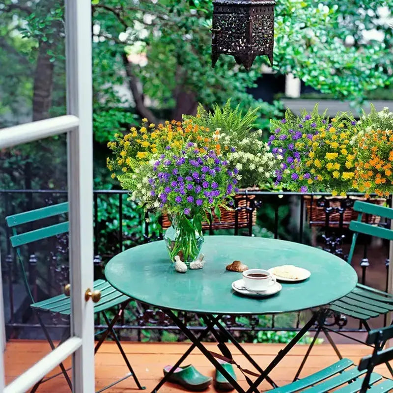 A vibrant green glass vase filled with a lush bouquet of purple, yellow, and white flowers.