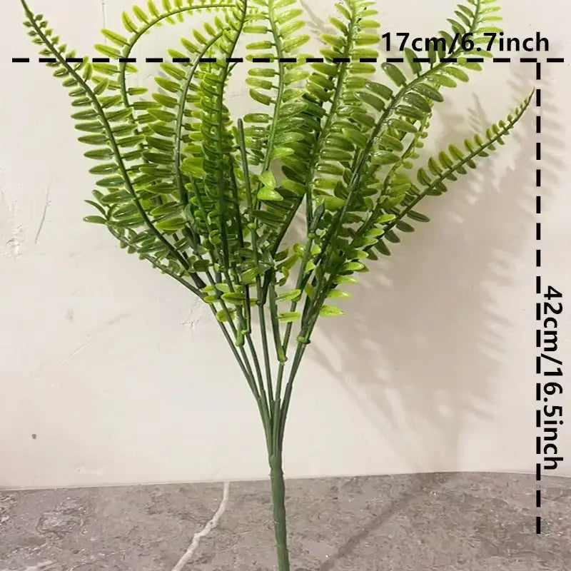 A vibrant green artificial fern with detailed, feathery fronds and a sturdy stem.
