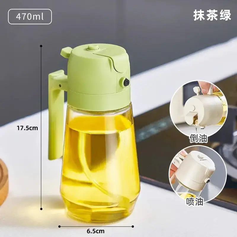 A 470ml light green plastic oil dispenser with a clear glass body and a handle, designed for pouring or spraying cooking oil.