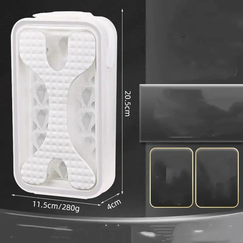 White plastic ice tray with a bone-shaped design and textured interior.