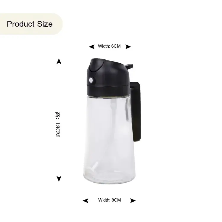 Clear glass oil dispenser with a black plastic lid and handle.