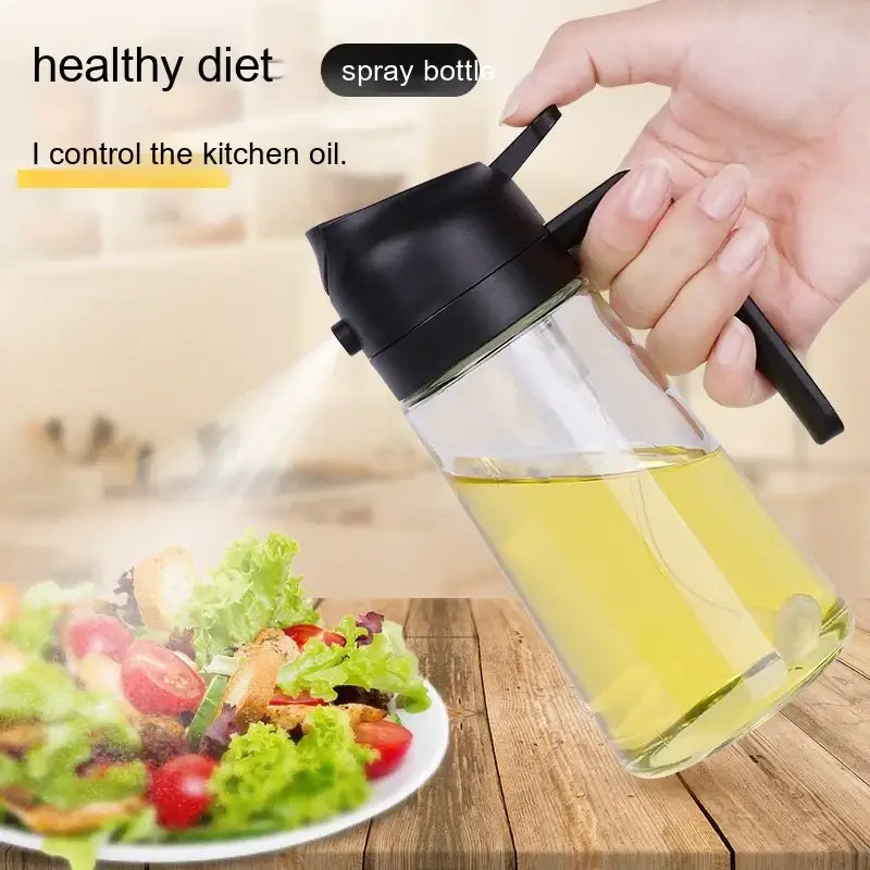 Clear glass spray bottle with a black plastic pump and handle, filled with golden-yellow oil.