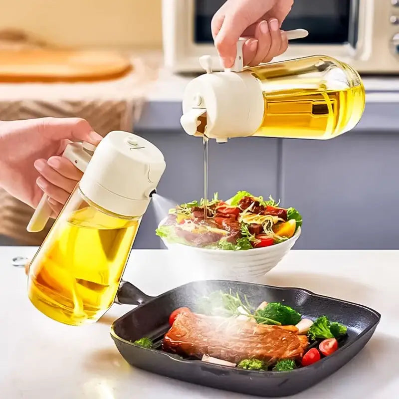 Clear glass oil dispenser with a white plastic pump and handle, filled with golden-yellow cooking oil.