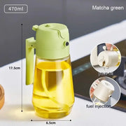 Matcha green 470ml oil dispenser with a clear glass body and plastic handle.