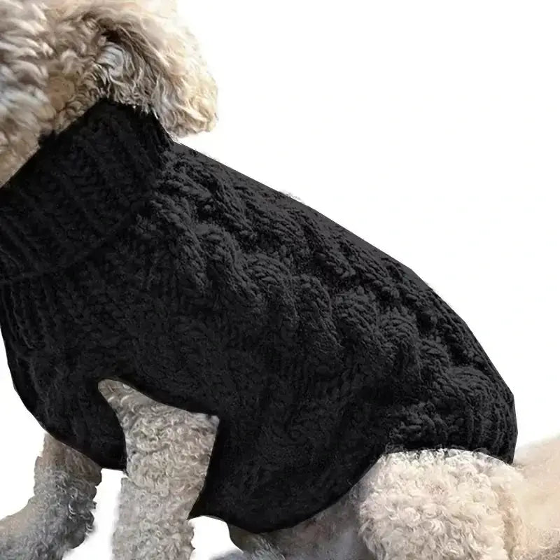 Black knitted sweater with a textured cable knit pattern.