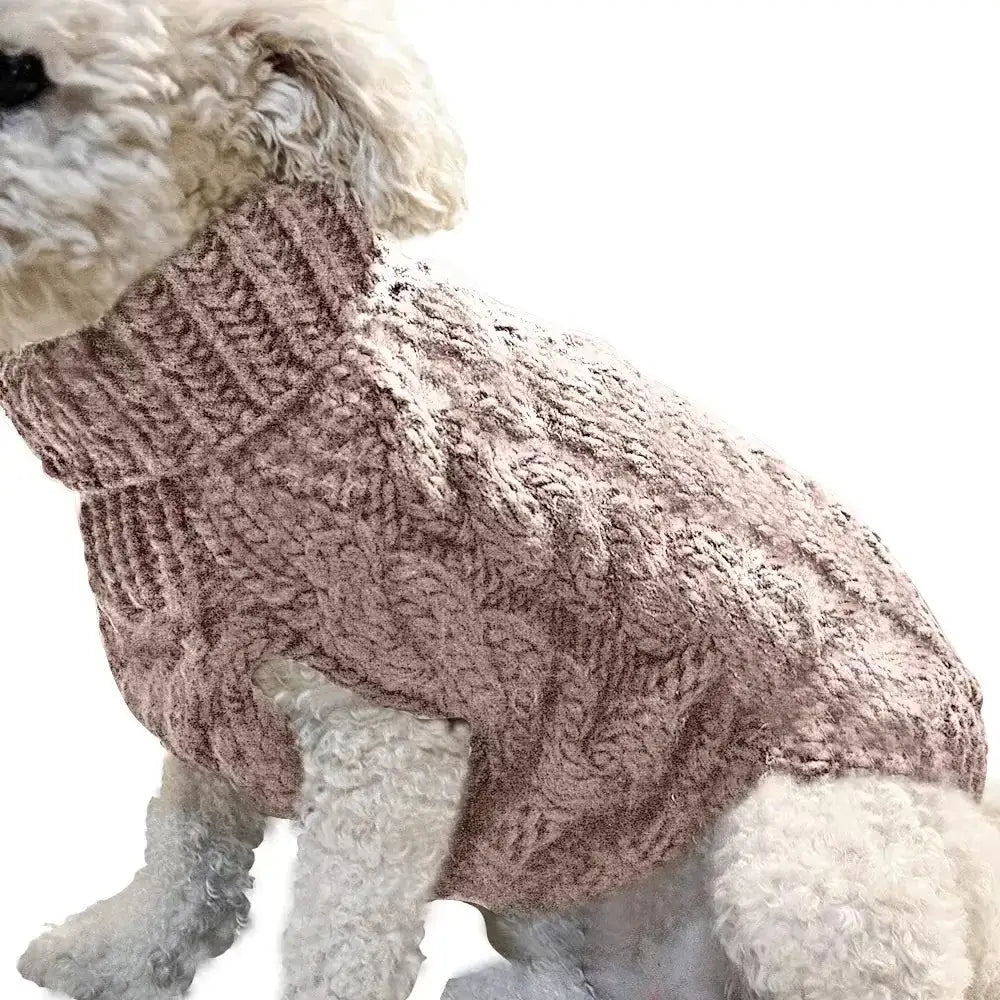 A cozy, dusty rose-colored knitted sweater with a textured cable-knit pattern and ribbed collar.