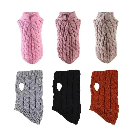 Knitted dog sweaters in pink, mauve, beige, gray, black, and rust with a cable-knit pattern and heart-shaped cutouts.
