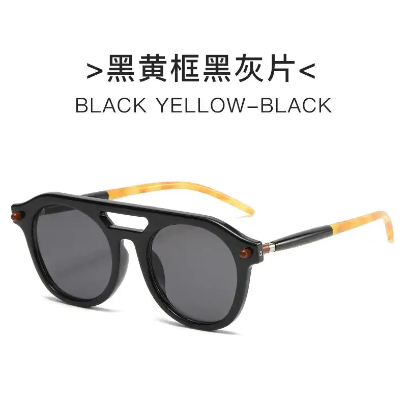 Black and yellow-framed sunglasses with dark gray lenses.
