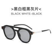 Black and white framed sunglasses with black gray lenses.