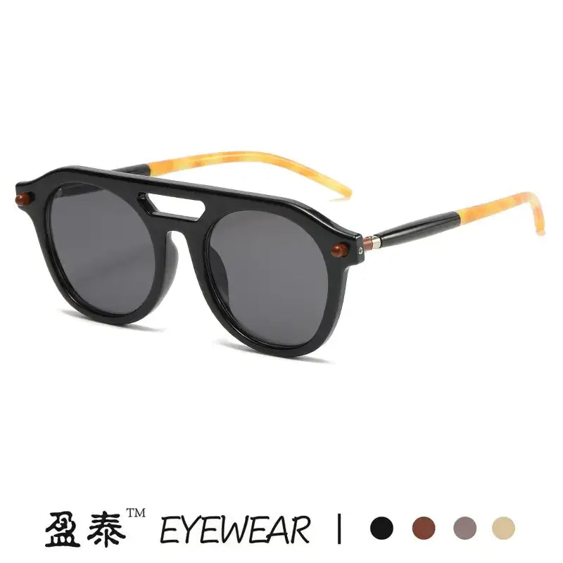 Black-framed sunglasses with tortoiseshell-patterned temple tips and dark gray lenses.