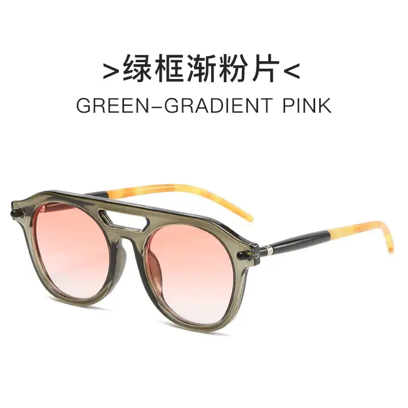 Green-gradient pink sunglasses with a matte olive frame and tortoiseshell-patterned arms.