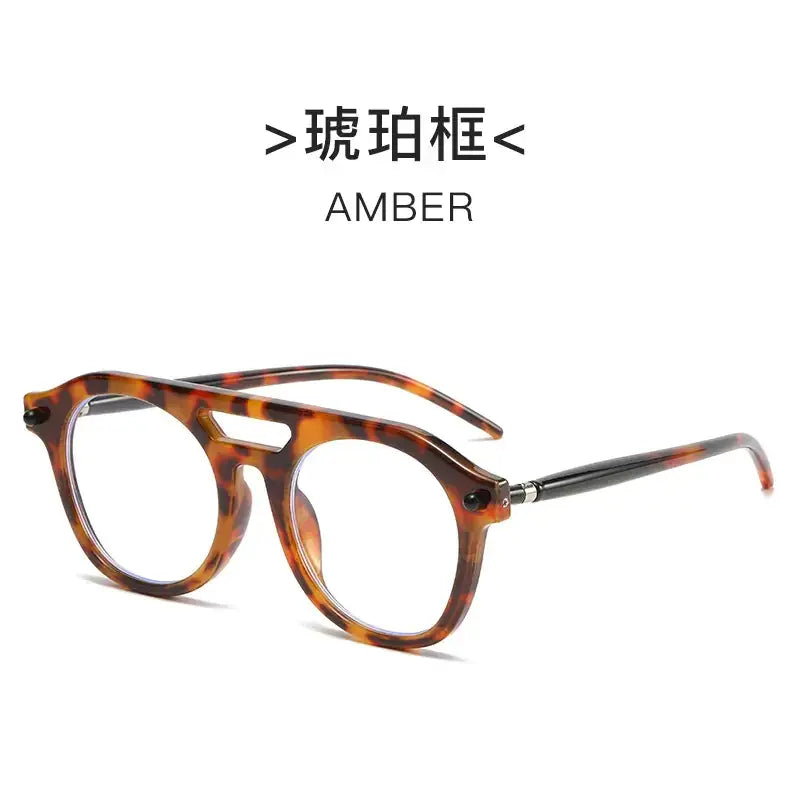 Amber tortoiseshell-framed reading glasses with a vintage-inspired design and clear lenses.