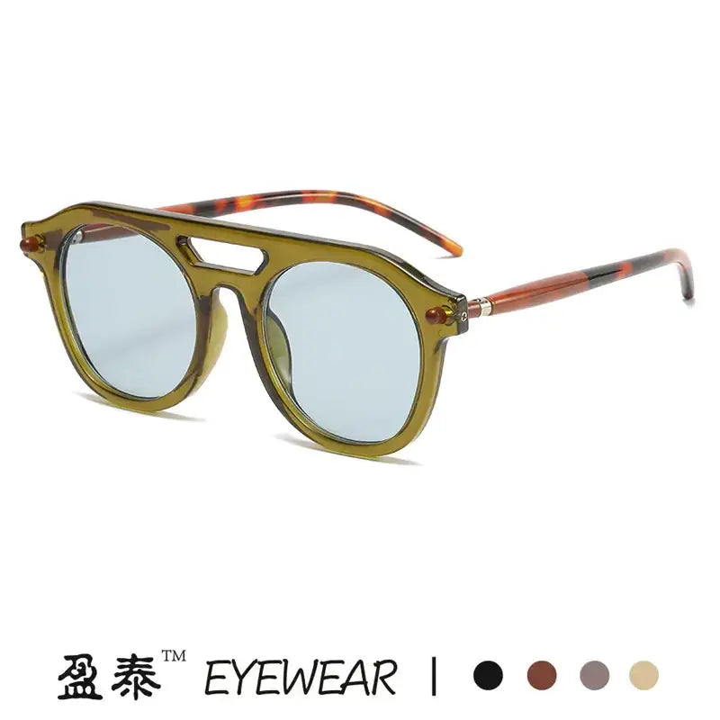 Olive-green acetate aviator sunglasses with tortoiseshell-patterned temples and light blue mirrored lenses.