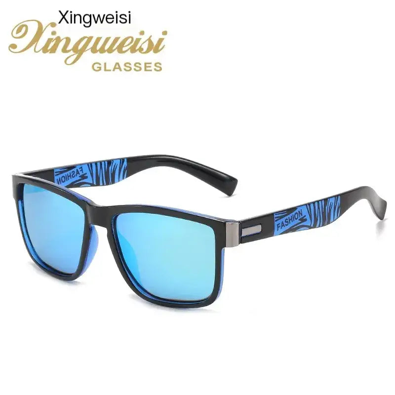 Black-framed sunglasses with blue mirrored lenses and a zebra-striped pattern on the temples, featuring ’fashion’ branding.