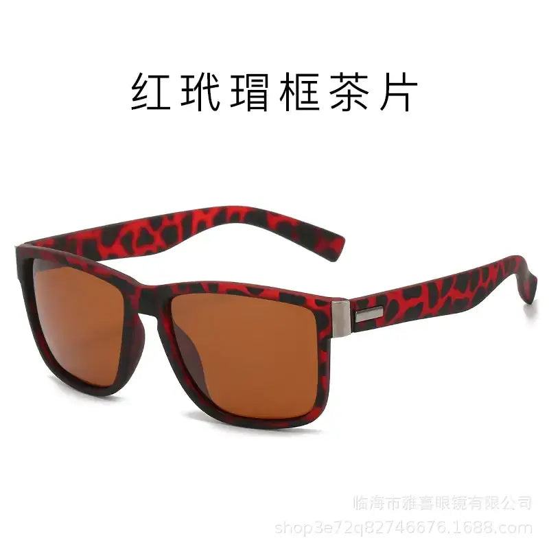 Red and black leopard-print framed sunglasses with amber-tinted lenses.