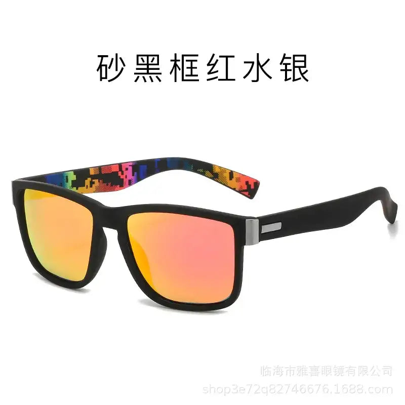 Black-framed sunglasses with vibrant orange and pink mirrored lenses, featuring colorful pixelated patterns on the temple tips.