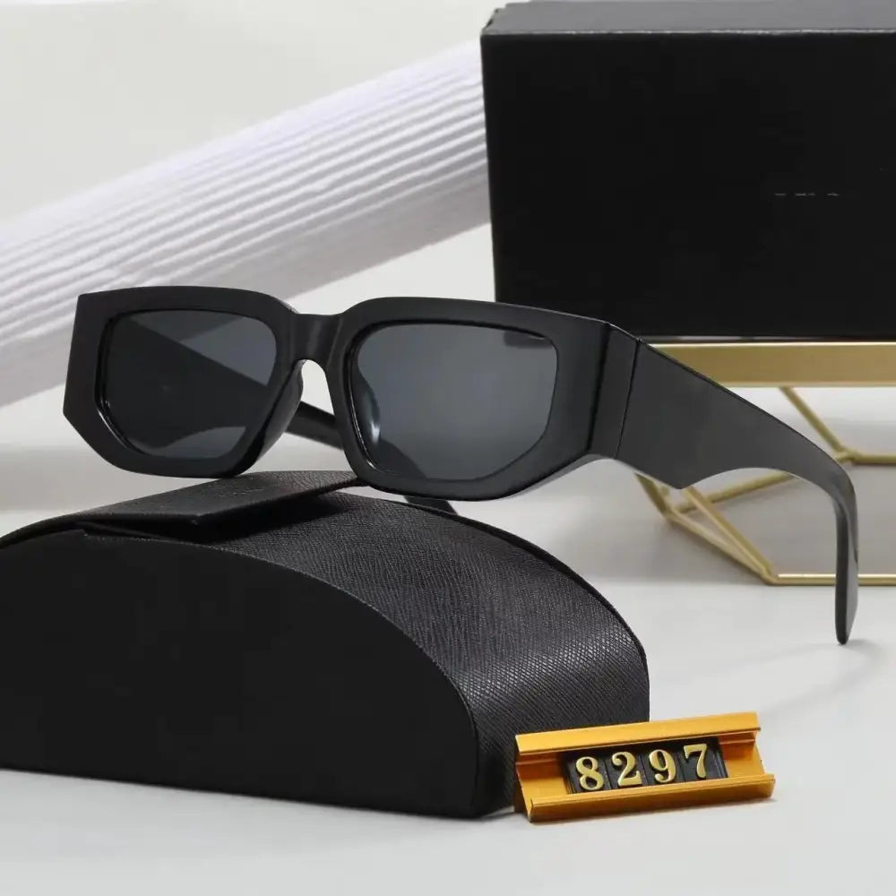 Black rectangular sunglasses with dark gray lenses and a sleek, modern design.