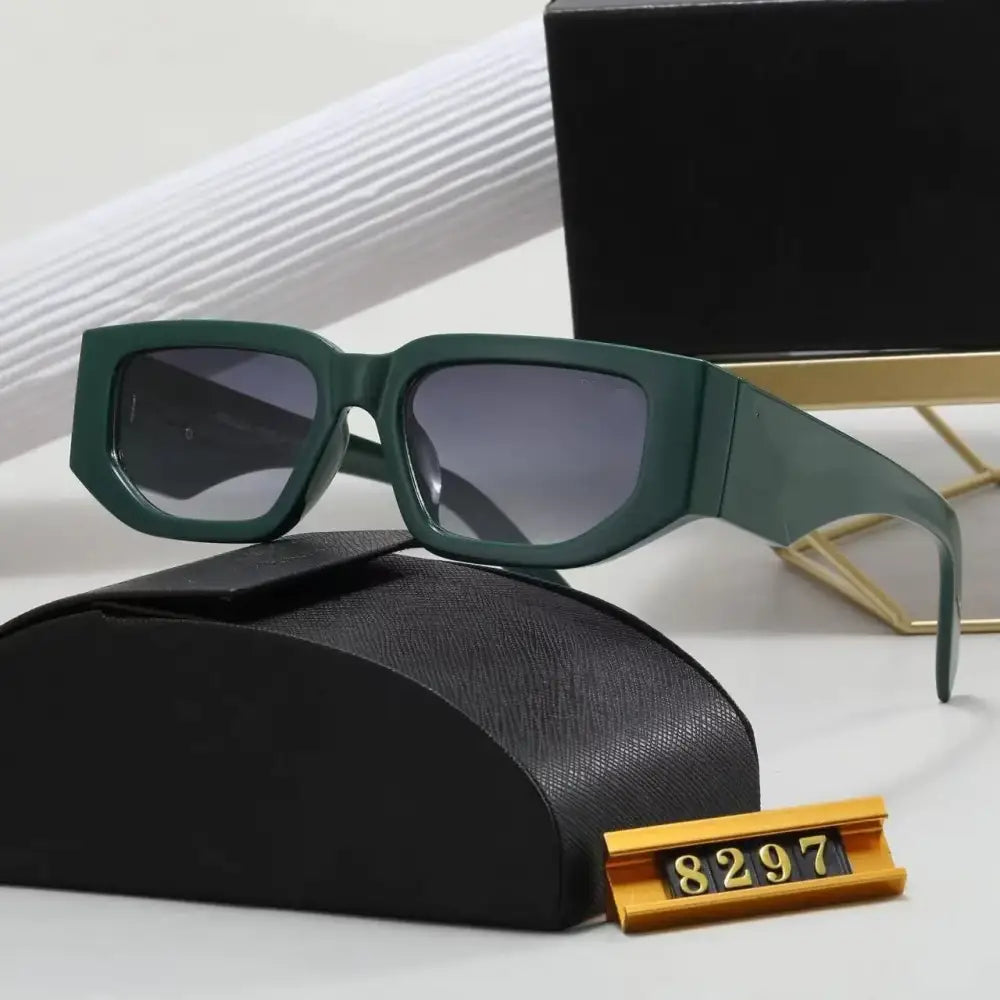 Dark green rectangular sunglasses with gradient gray lenses, resting on a black textured case.