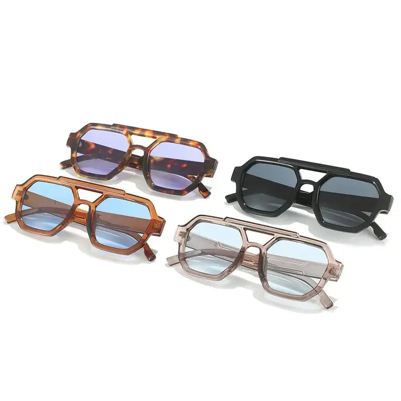 Four pairs of stylish, geometric-frame sunglasses in tortoiseshell, black, and translucent brown with blue-tinted lenses.