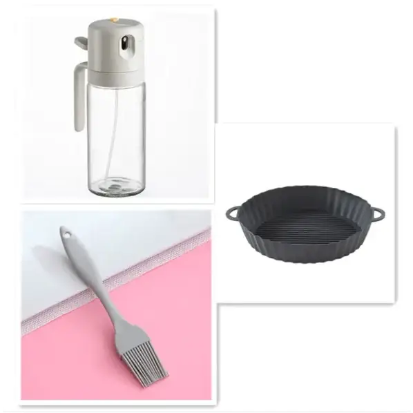 Gray silicone oil sprayer with a clear glass body and a white handle