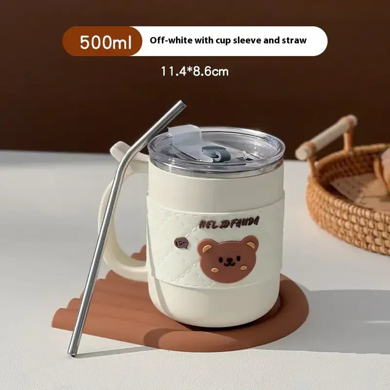 Off-white 500ml insulated tumbler with a cute bear design and cup sleeve, featuring a clear lid and metal straw.