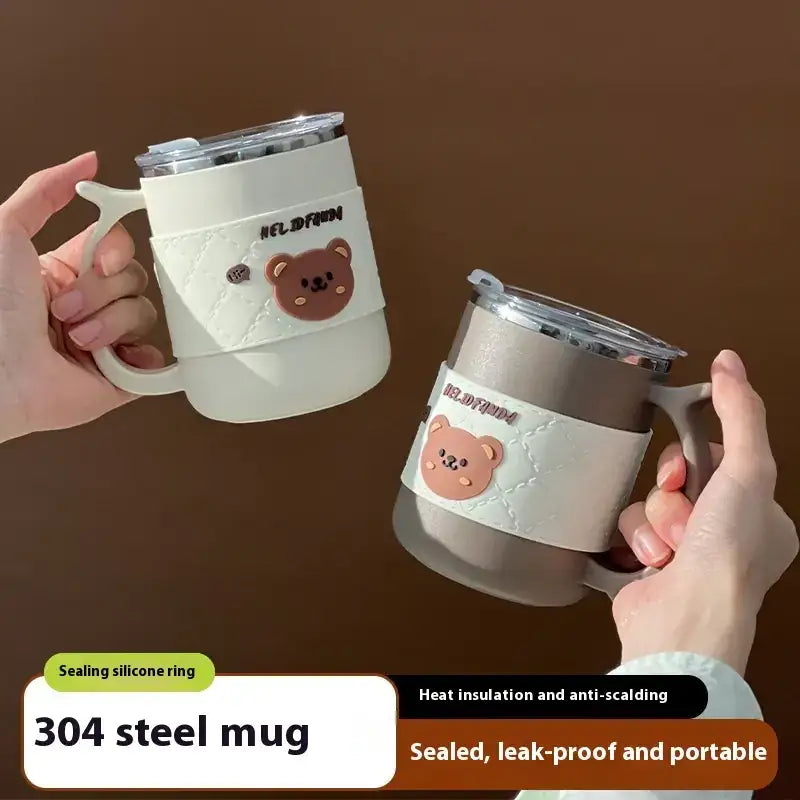 White and silver 304 steel mugs with silicone handles, each featuring a cute brown bear face decal.