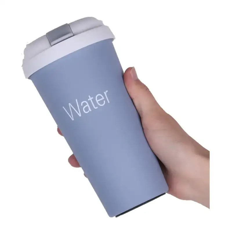 Light blue insulated travel mug with white lid and silver latch, featuring the word ’water’ printed in a clean sans-serif font.