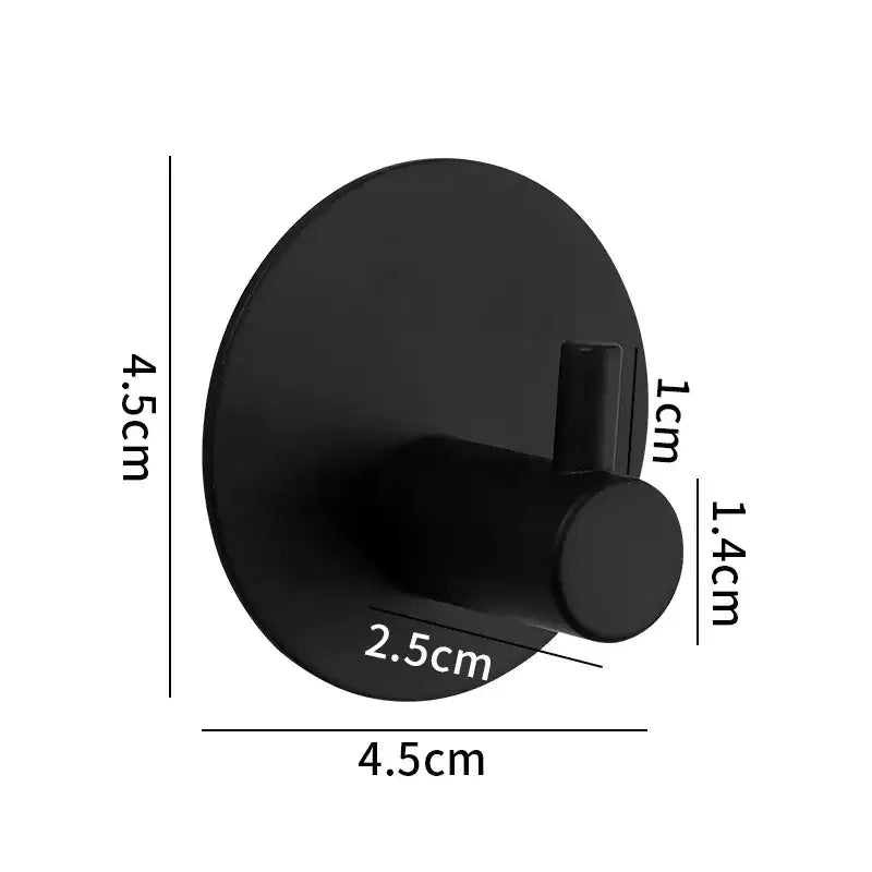 Black circular wall-mounted hook with a matte finish and rounded edges.