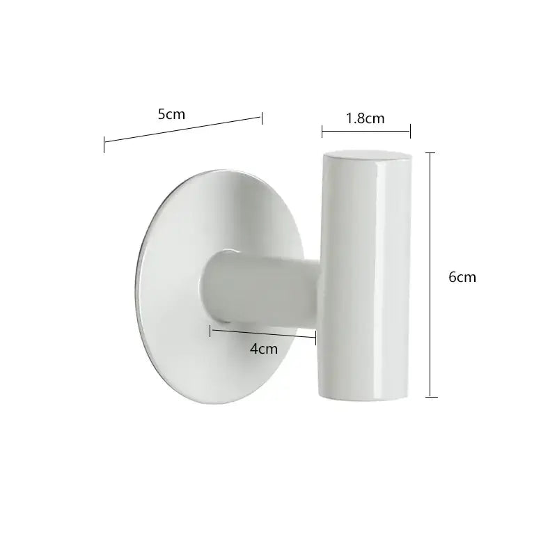 White ceramic wall-mounted hook with a circular base and cylindrical stem.