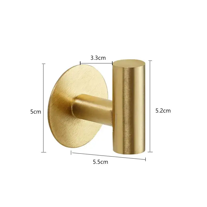 Gold-colored, brushed metal wall hook with a circular base and cylindrical hanging arm.
