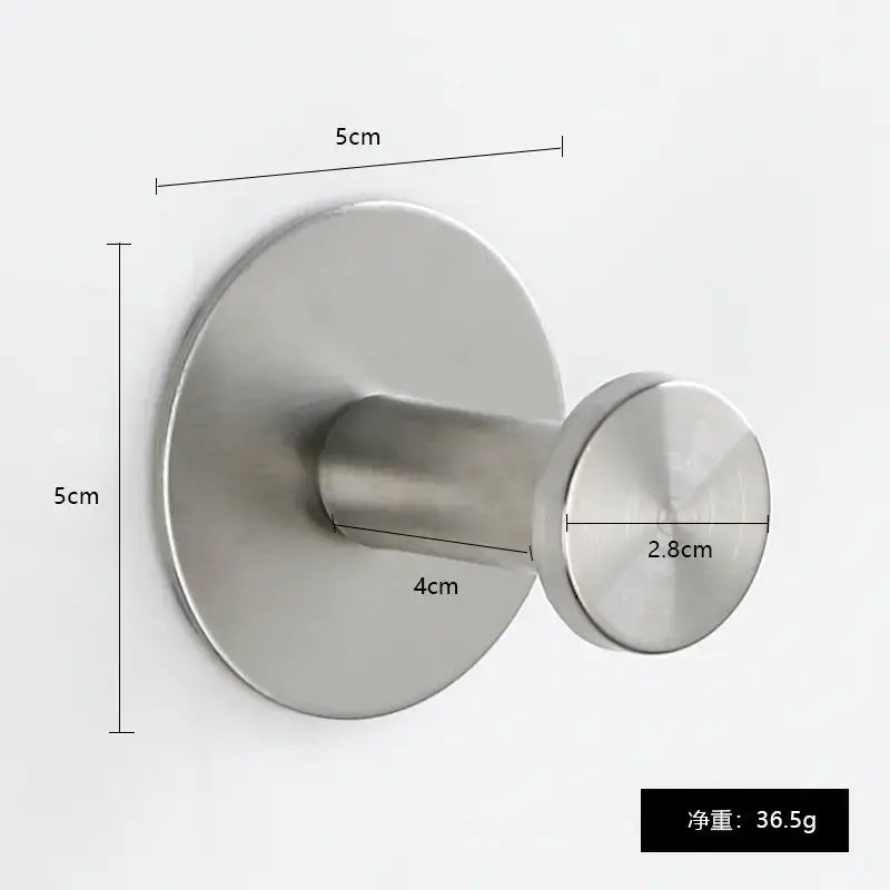 A sleek, minimalist stainless steel wall hook with a circular base and cylindrical hanging end.